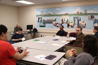 A students engage in a learning game during the specialized Autism class at Goodwill's Work Adjustment Training Program.