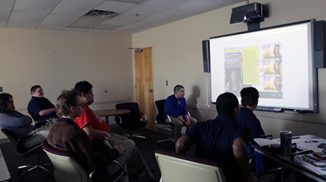 Students watch an instruction module during the specialized Autism class at Goodwill's Work Adjustment Training Program.