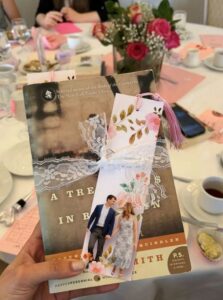 Picture of a book and a bookmark used as a party favor in a wedding.