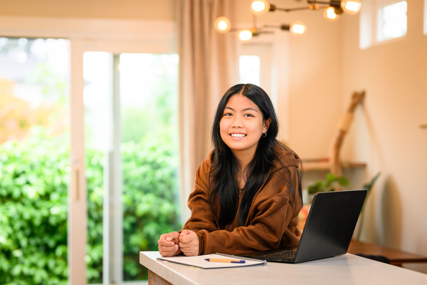 Women smiling in front of a computer