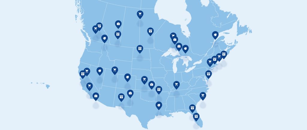 Map of North America with blue location pins marking shopping destinations across the United States and Canada.