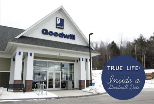 Goodwill storefront with glass doors and a blue circular badge reading 'TRUE LIFE Inside a Goodwill Date' in a snowy lot.