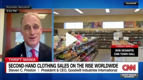 CNN interview with Goodwill CEO Steve C. Preston about thrift-store clothing sales; store aisle in background.