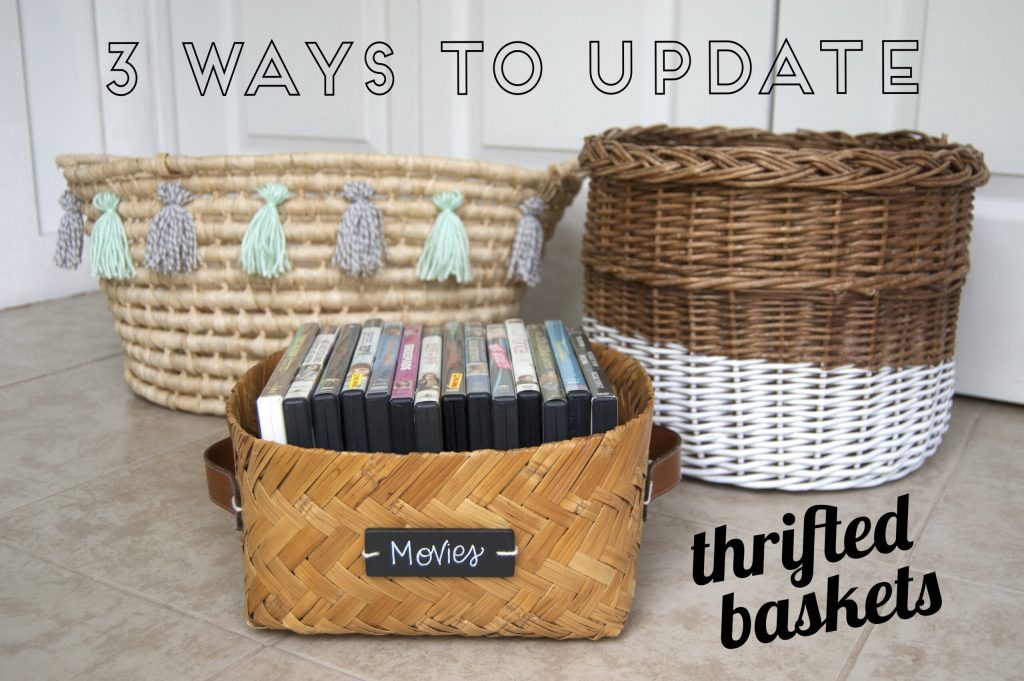 Three woven baskets on a tiled floor; in front is a small braided basket filled with VHS tapes labeled 'Movies'.