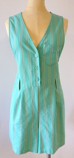 Mint green sleeveless striped dress on a mannequin with a V-neck and front button placket.