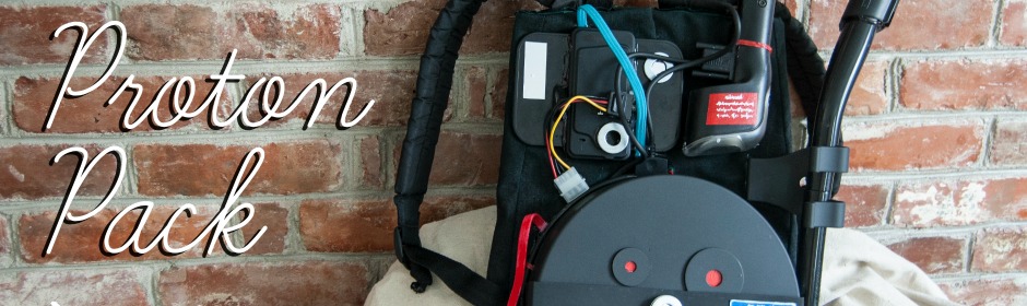 Proton Pack prop from Ghostbusters leaning against a brick wall