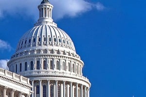 US Capitol dome against a clear blue sky