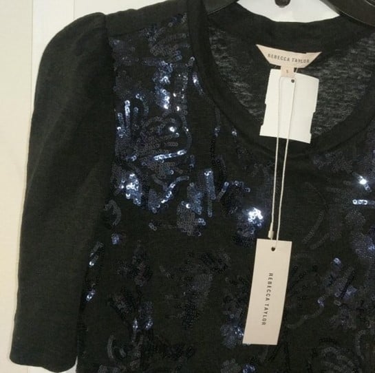 A black sequined blouse