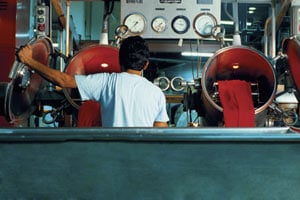 Man in factory, rear view