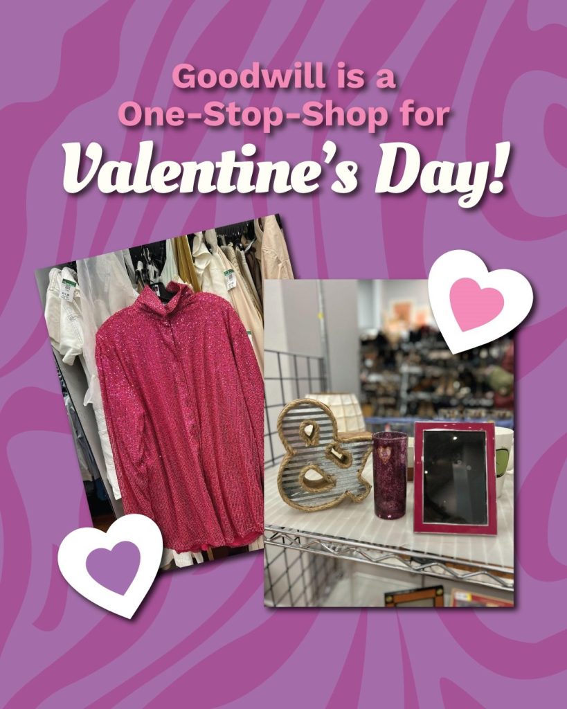 Goodwill Valentine's Day display with a pink glitter dress and heart decor on a purple patterned background.