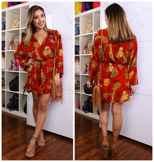 Woman in red leopard print romper with tan sandals posing in a walk-in closet with shelves of handbags.
