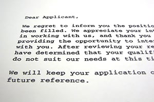 Typed rejection letter informing applicant the position has been filled.
