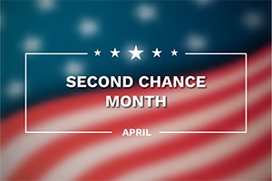 Second Chance Month banner with stars over a blurred American flag background, April.