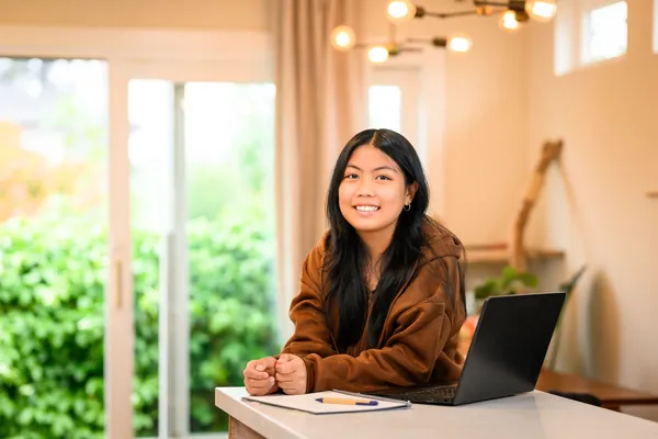 Women smiling in front of a computer